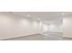Large finished basement with recessed lighting, light walls and floors, offering flexible space at 11760 Stratham Dr, Alpharetta, GA 30009