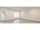 Bright finished basement featuring light walls and floors, natural light, and an exterior door at 11760 Stratham Dr, Alpharetta, GA 30009