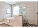 Elegant bathroom featuring a modern tub and glass-enclosed shower at 11760 Stratham Dr, Alpharetta, GA 30009