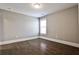 Bedroom with hardwood floors and natural light at 11760 Stratham Dr, Alpharetta, GA 30009