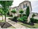 Beautifully landscaped front yard with lush greenery, mature trees and manicured bushes at 11760 Stratham Dr, Alpharetta, GA 30009