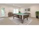Entertaining game room with a pool table and stylish decor, perfect for recreational activities at 11760 Stratham Dr, Alpharetta, GA 30009