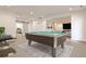 Entertaining game room with a pool table, gym, and access to additional recreation areas at 11760 Stratham Dr, Alpharetta, GA 30009