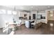 Open kitchen and breakfast nook with stainless appliances and granite countertops at 11760 Stratham Dr, Alpharetta, GA 30009