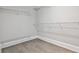 Walk-in closet with shelving providing ample storage space at 11760 Stratham Dr, Alpharetta, GA 30009