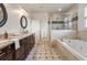 Spacious bathroom with double sinks, large soaking tub, and tiled floors at 629 Boulevard Ne, Atlanta, GA 30308