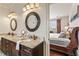 Bathroom with dual sinks and granite countertops with a view to the bedroom at 629 Boulevard Ne, Atlanta, GA 30308