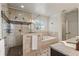 Bright bathroom featuring a glass shower, soaking tub, and tile flooring at 629 Boulevard Ne, Atlanta, GA 30308