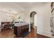 Open concept dining room adjacent to kitchen featuring hardwood floors and arched entryways at 629 Boulevard Ne, Atlanta, GA 30308