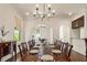 Dining room featuring hardwood floors, fireplace and large table, with a view to the office and kitchen at 629 Boulevard Ne, Atlanta, GA 30308