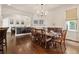 Dining room with hardwood floors and large table set for a dinner party, with access to the kitchen at 629 Boulevard Ne, Atlanta, GA 30308