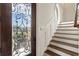 Elegant entryway featuring a decorative glass door and staircase with wood treads at 629 Boulevard Ne, Atlanta, GA 30308
