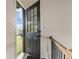 Bright entryway with an open door leading to a backyard and a black metal railing at 629 Boulevard Ne, Atlanta, GA 30308