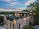 A brick apartment building featuring a rooftop terrace with an outdoor kitchen and comfortable seating at 629 Boulevard Ne, Atlanta, GA 30308