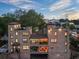 Unique brick exterior home featuring multiple floors, rooftop terraces, and views of the surrounding neighborhood at 629 Boulevard Ne, Atlanta, GA 30308