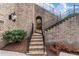 Well-maintained brick steps with black iron railings lead to the front entrance of this charming property at 629 Boulevard Ne, Atlanta, GA 30308