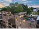 Brick apartment building featuring rooftop terraces perfect for outdoor entertainment and relaxing at 629 Boulevard Ne, Atlanta, GA 30308