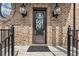 Stunning front door with decorative glass and elegant lighting create a welcoming entrance to the home at 629 Boulevard Ne, Atlanta, GA 30308