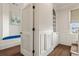 Hallway featuring a cozy reading nook, a built-in cabinet, and natural light at 629 Boulevard Ne, Atlanta, GA 30308