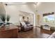 Living room featuring hardwood floors, high ceilings, balcony, and an open layout at 629 Boulevard Ne, Atlanta, GA 30308