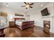 Spacious main bedroom with a fireplace, ceiling fan, and access to a private balcony at 629 Boulevard Ne, Atlanta, GA 30308