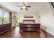 Bright main bedroom with a balcony, dark wood furniture and hardwood floors at 629 Boulevard Ne, Atlanta, GA 30308