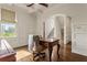 A home office with hardwood floors, panelled walls, coffered ceilings, and large windows for great natural light at 629 Boulevard Ne, Atlanta, GA 30308