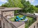 Roof deck featuring outdoor seating, a dining area, and a built-in grill at 629 Boulevard Ne, Atlanta, GA 30308