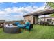 Enjoy the rooftop deck with fireplace, outdoor kitchen, and lounge seating for relaxing and entertaining under blue skies at 629 Boulevard Ne, Atlanta, GA 30308