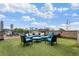 Enjoy the skyline views from this rooftop terrace with an outdoor fireplace, comfortable seating, and an outdoor kitchen at 629 Boulevard Ne, Atlanta, GA 30308