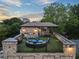 Beautiful rooftop terrace with brick accents, comfortable seating, grill, and outdoor dining area perfect for entertaining at 629 Boulevard Ne, Atlanta, GA 30308