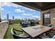 Rooftop terrace offers skyline views, a fireplace, dining area, and comfortable seating for relaxation and entertainment at 629 Boulevard Ne, Atlanta, GA 30308