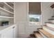 Staircase landing with built-in storage and a window offering lots of natural light at 629 Boulevard Ne, Atlanta, GA 30308