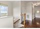 Bright staircase landing with hardwood floors and decorative iron railing details at 629 Boulevard Ne, Atlanta, GA 30308
