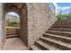 Picturesque walkway and steps made of brick lead to beautiful landscaped areas of the property at 629 Boulevard Ne, Atlanta, GA 30308