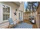Back deck with outdoor seating, rug, and grill, perfect for entertaining at 632 Plaza Se Dr # 6, Kennesaw, GA 30144