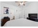 Bedroom features neutral tones, a ceiling fan, and access to the bathroom and closet at 632 Plaza Se Dr # 6, Kennesaw, GA 30144