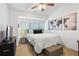 Cozy bedroom with natural light, ceiling fan, and stylish decor at 632 Plaza Se Dr # 6, Kennesaw, GA 30144