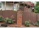 Townhouse complex exterior, showing a wooden fence and landscaping at 632 Plaza Se Dr # 6, Kennesaw, GA 30144