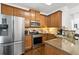 Well-lit kitchen features stainless steel appliances and granite countertops at 632 Plaza Se Dr # 6, Kennesaw, GA 30144
