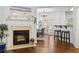 Cozy living room with a fireplace, hardwood flooring, and an adjacent dining area at 632 Plaza Se Dr # 6, Kennesaw, GA 30144