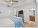 This main bedroom features a gray dresser and a door leading to the ensuite bathroom at 632 Plaza Se Dr # 6, Kennesaw, GA 30144