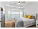 Bright main bedroom with a tray ceiling, a large window, and neutral colors create a welcoming atmosphere at 632 Plaza Se Dr # 6, Kennesaw, GA 30144