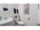 Bright half bathroom featuring a pedestal sink and stylish decor at 632 Plaza Se Dr # 6, Kennesaw, GA 30144