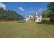 Large backyard with a trampoline, perfect for outdoor enjoyment and play at 6455 Crystal Ln, Cumming, GA 30040