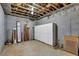 Unfinished basement featuring a cement floor and exposed beams at 6455 Crystal Ln, Cumming, GA 30040