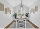 Elegant dining room with vaulted ceilings, modern light fixture, and stylish table, perfect for gatherings at 6455 Crystal Ln, Cumming, GA 30040
