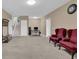 Living room featuring carpeted floors and an office space at 6455 Crystal Ln, Cumming, GA 30040