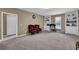 Room featuring an office setup, carpeting and built-in shelves at 6455 Crystal Ln, Cumming, GA 30040