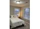 Bedroom with neutral walls, carpeted floor, and a bright window at 7245 W Strickland St, Douglasville, GA 30134